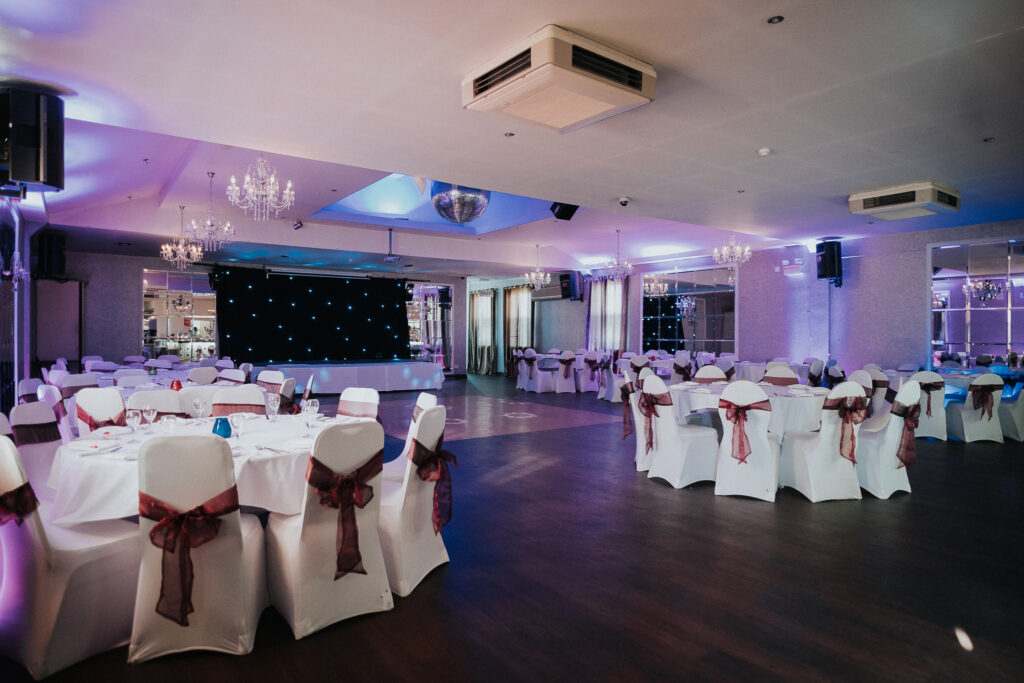 Smokey Barrels function room dressed for a private party, with dance floor and stage
